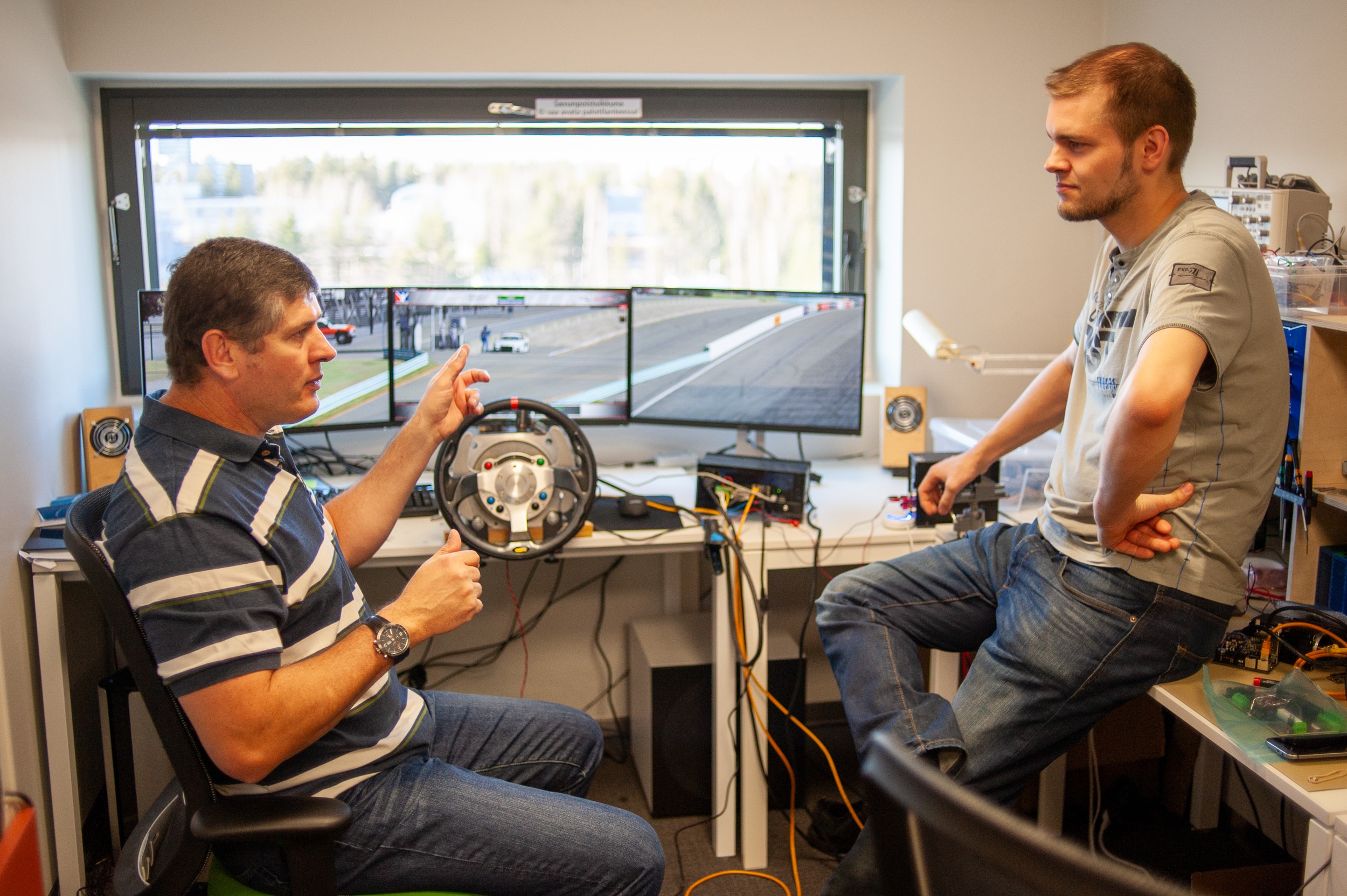 Simucube co-founder Tero and community member Phillip planning Simucube 1.