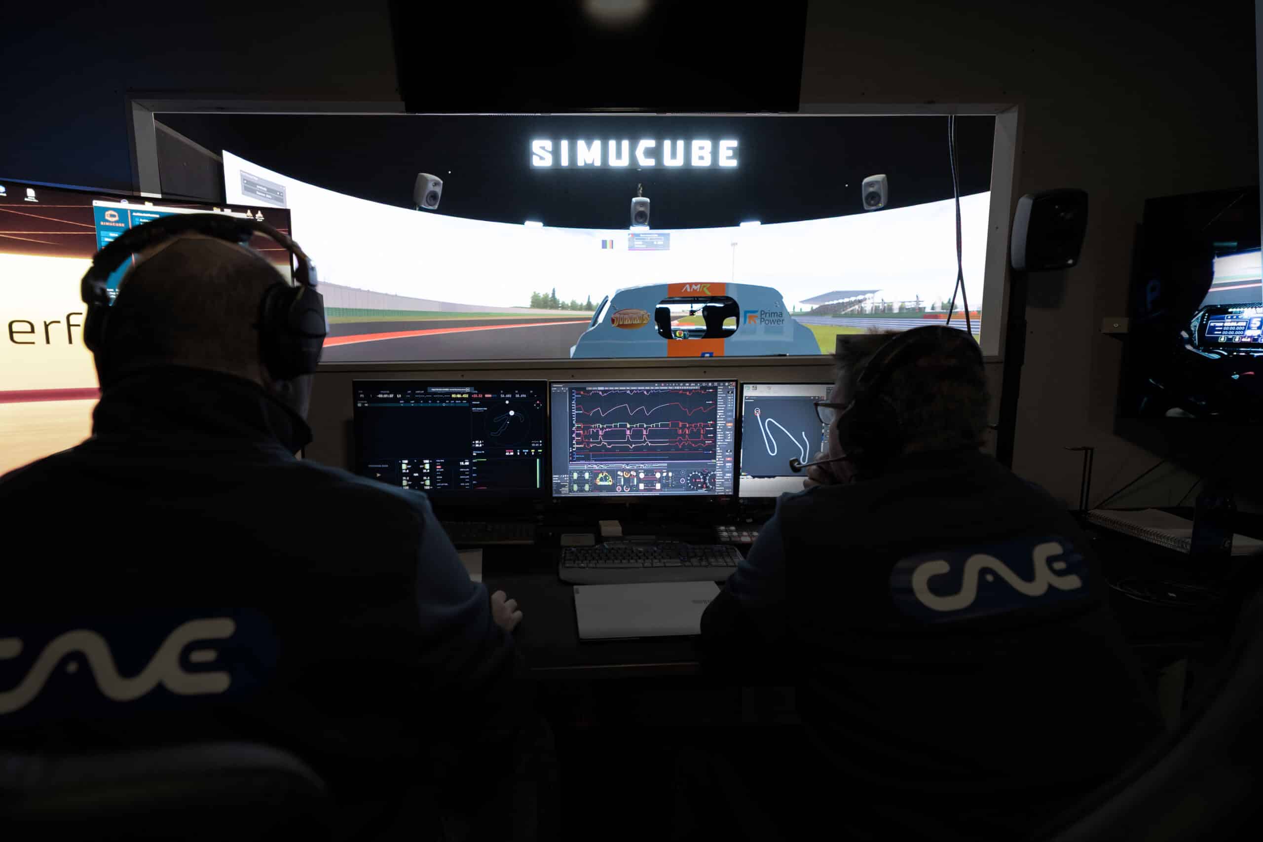 Coach reviewing telemetry data with a driver at the Simucube Performance Center